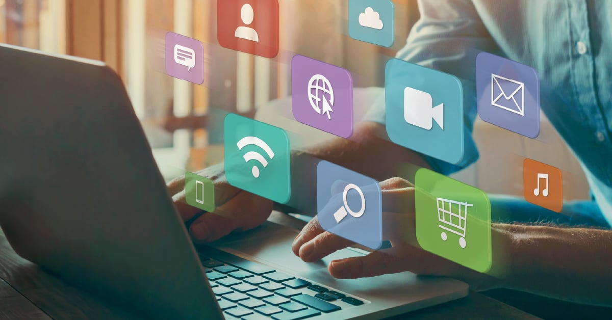 A man typing on a laptop.