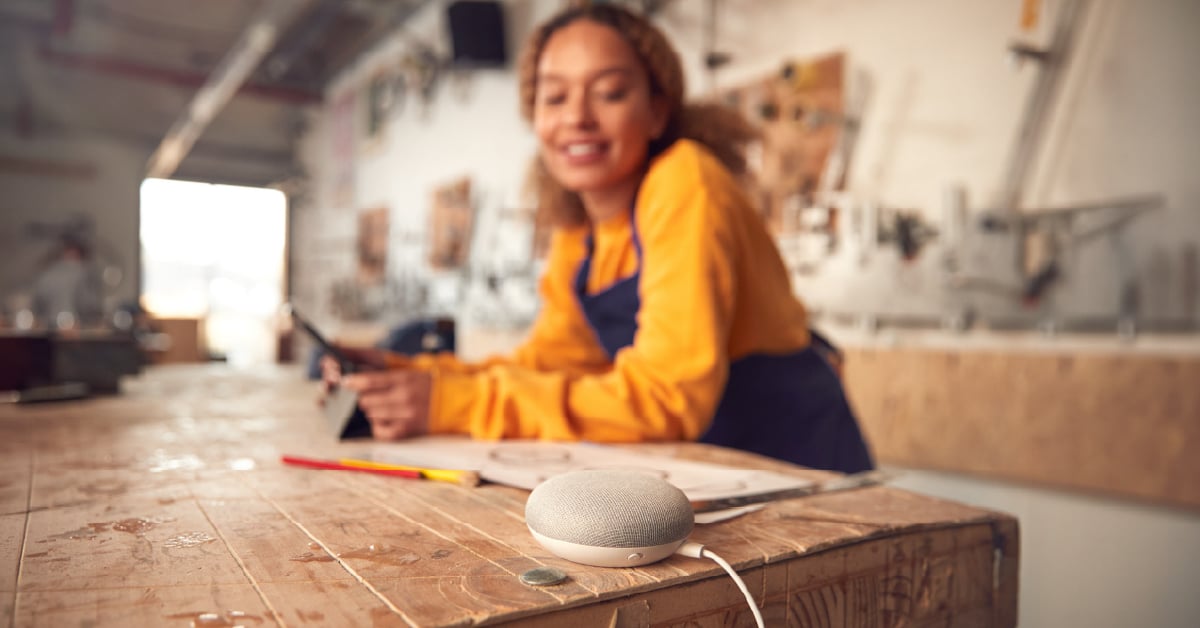 small-business-owner-listening-to-speaker